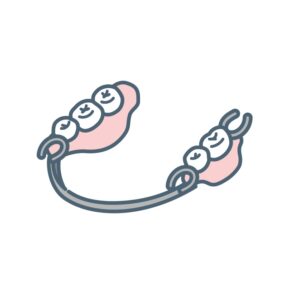 残っている歯に固定して使用する部分入れ歯のイメージイラスト